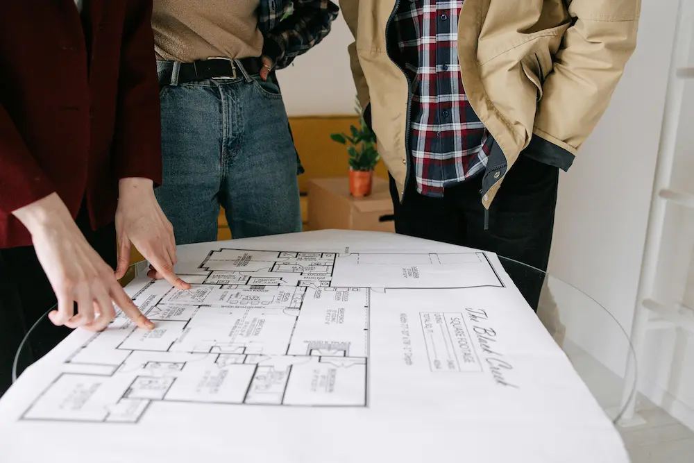 Couple in front of their new home